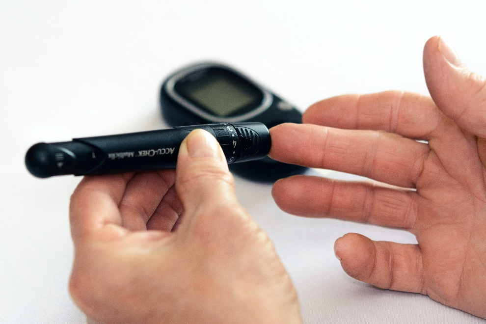 Person testing his blood sugar using a glucometer